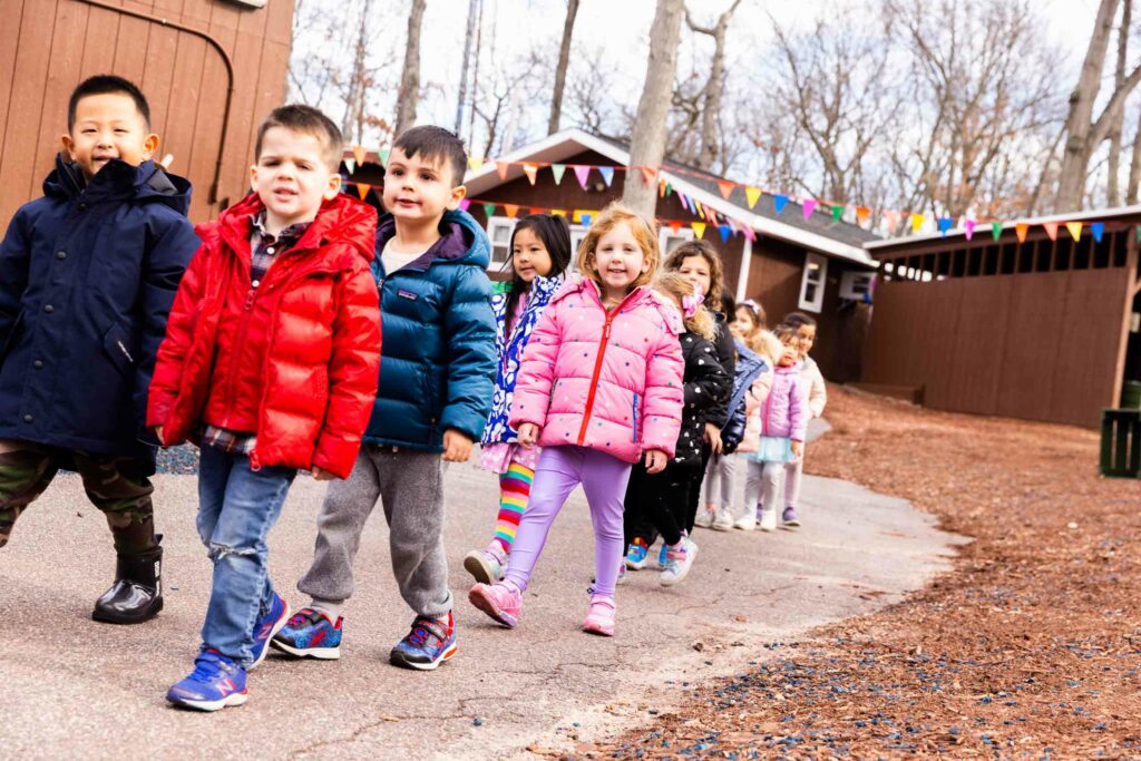 Kids walking in a line.