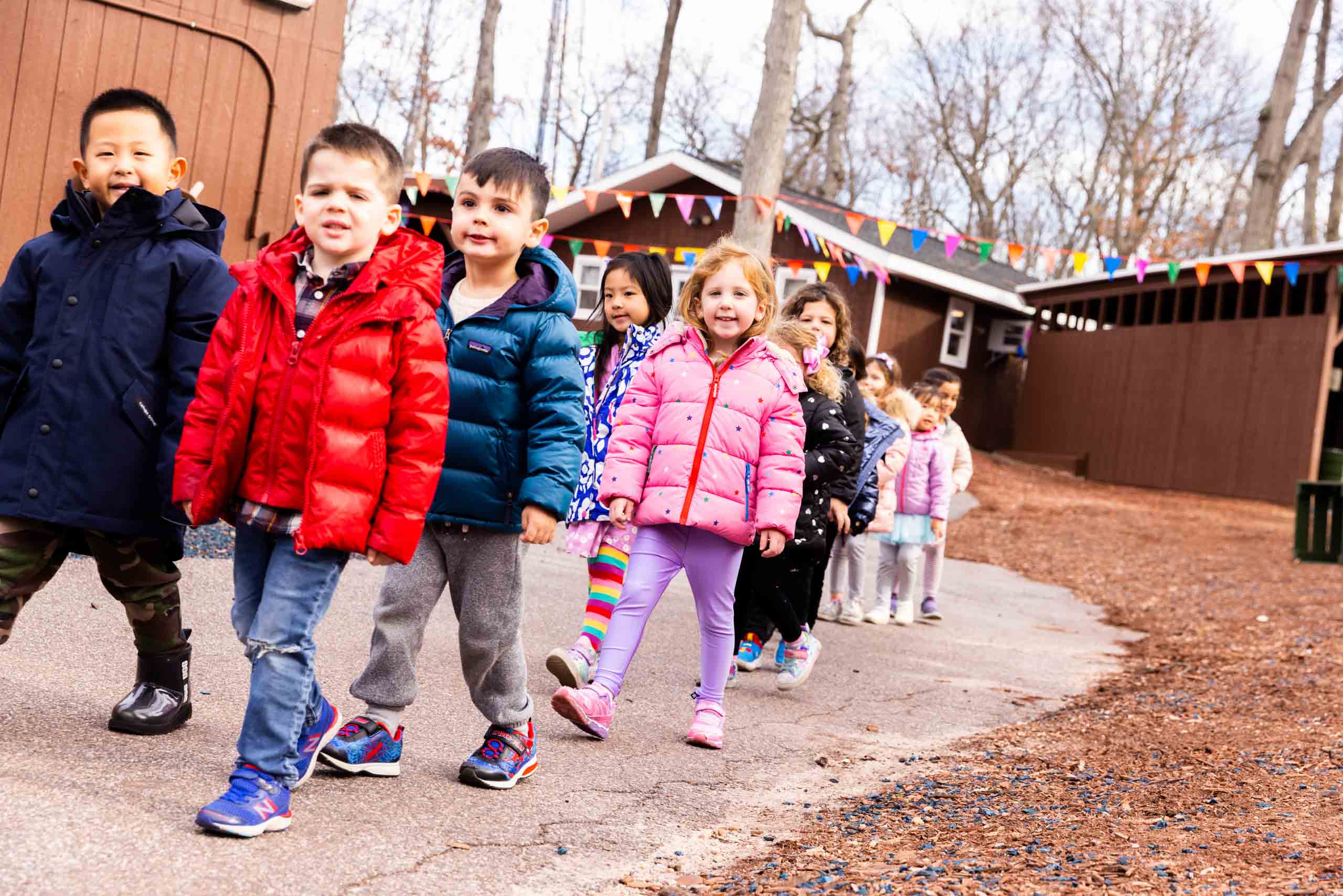 Kids walking in a line.